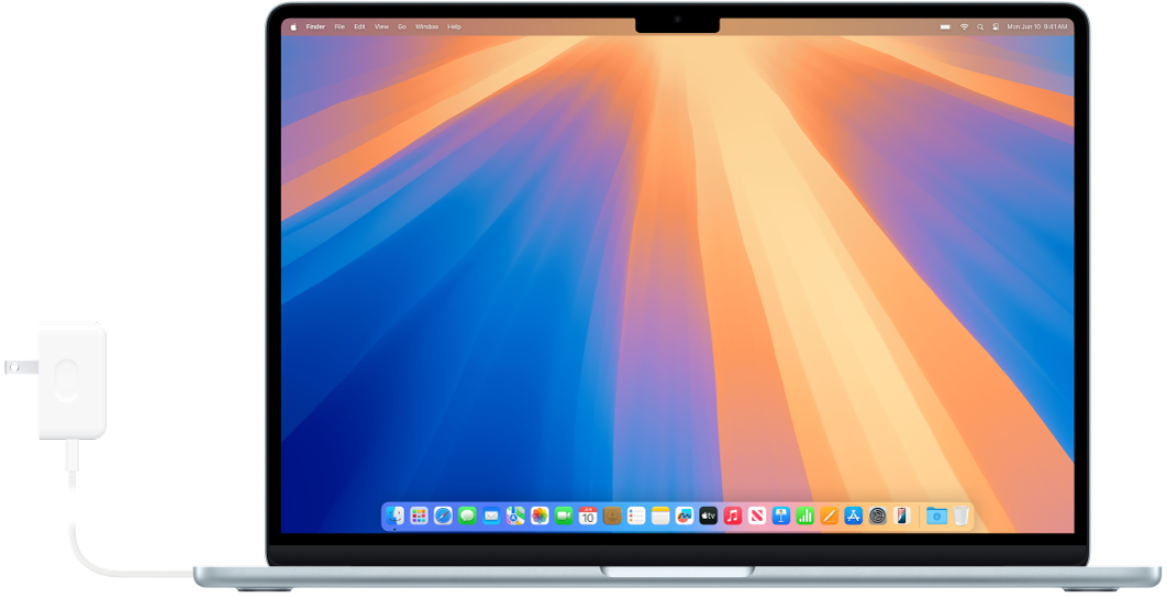 Un MacBook Air con el adaptador de corriente conectado.