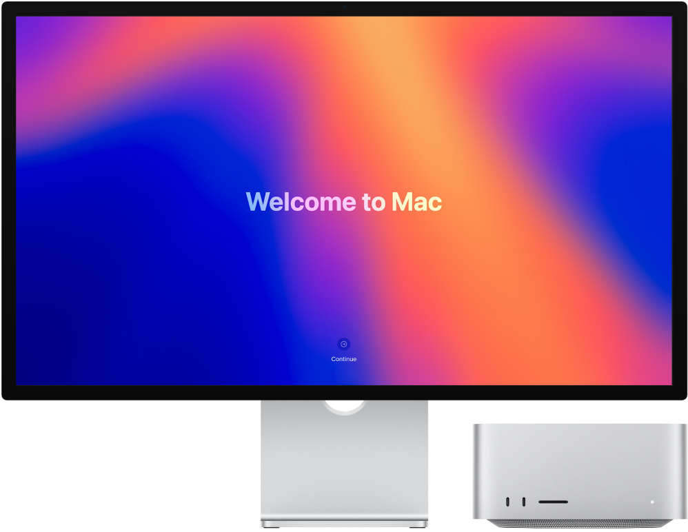 Una pantalla Studio Display con un Mac Studio al lado y la palabra “Te damos la bienvenida al Mac” en la pantalla.